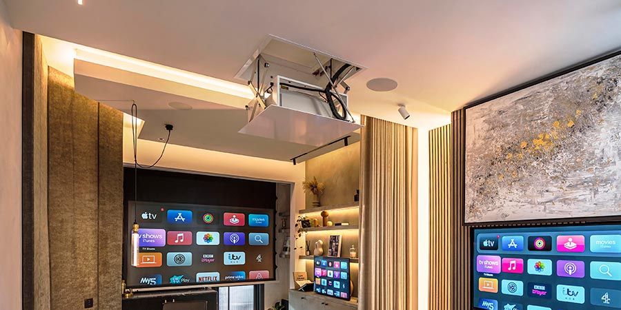 Projector lift opening from a ceiling in a living room