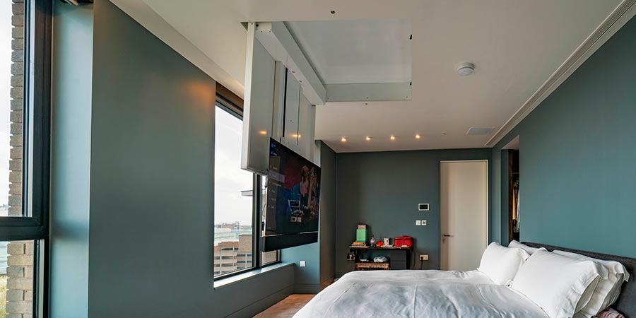 Close-up of a display lifting from a cabinet