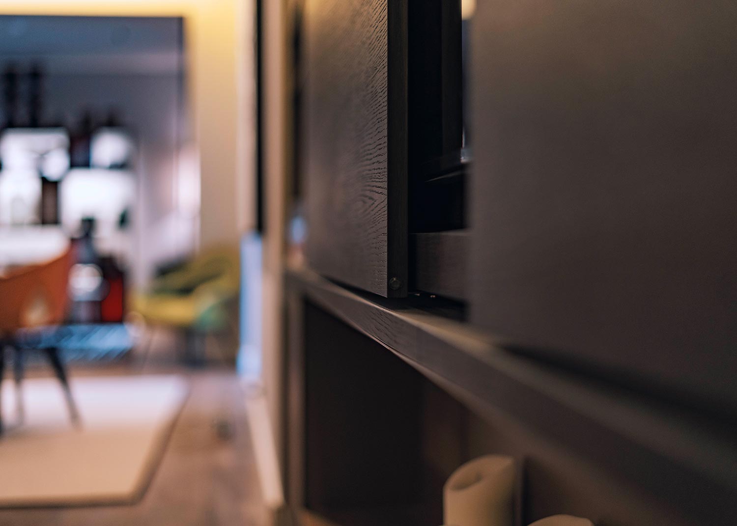 Close view of dark wood cabinet panel in a home interior