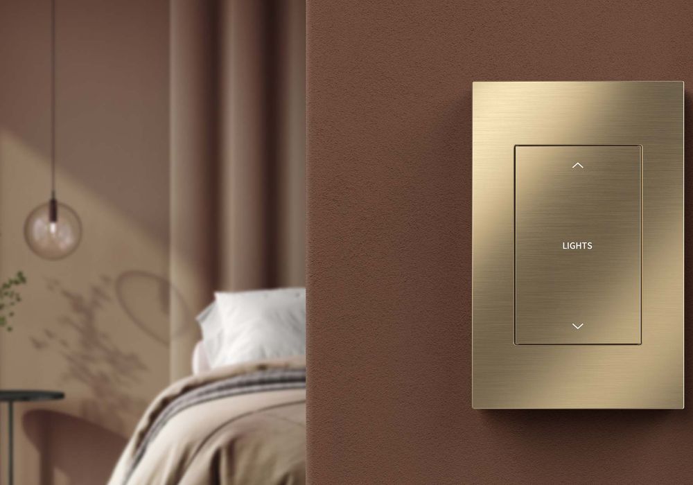 Crestron touch panel in living room with brown couch and semi-closed shades