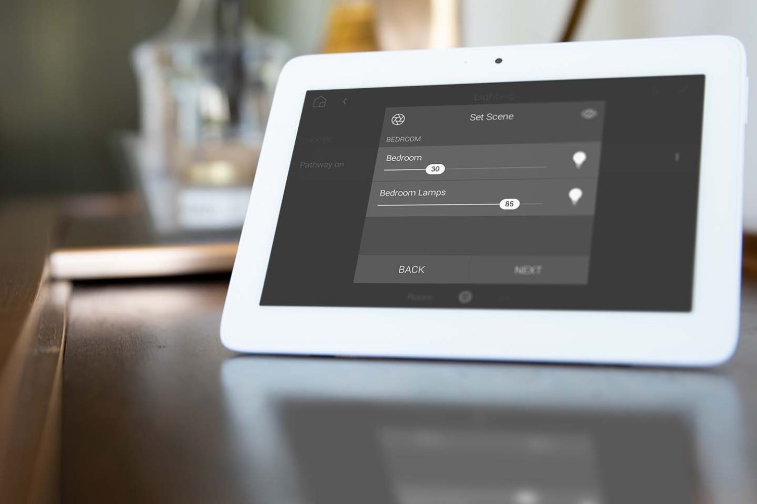 Person touching a Control4 keypad on the wall