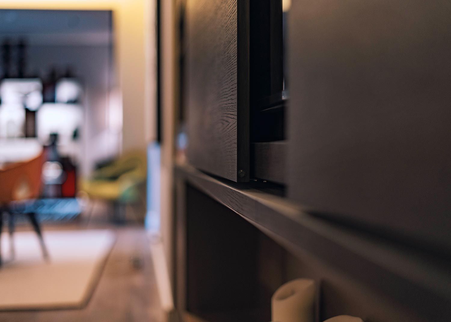 Close view of dark wood cabinet panel in a home interior